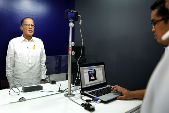 President Benigno Aquino 3rd stands before a digital camera to have his picture taken as part of the new ePassport processing system which was demonstrated at the high security printing plant of the APO Production Unit in Malvar, Batangas. MALACAÑANG PHOTO