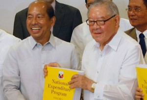 MONEY MATTERS Speaker Feliciano Belmonte Jr (right) receives a copy of the proposed 2016 national budget from Budget Secretary Butch Abad.  PHOTO BY MIGUEL DE GUZMAN