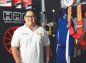 Francis Aguila shows off the high-end products sold at Autoperformance PH like Sabelt racing suits and belts and HRW wheels.