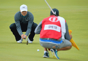 US golfer Jordan Spieth lines up a putt on the 4th green during his third round, on Day Four of the 2015 British Open Golf Championship on The Old Course at St Andrews in Scotland, on Monday. AFP PHOTO