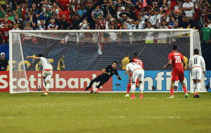 Mexico’s Andres Guardado (left) scores a penalty past Panama’s goalkeeper Jaime Penedo during a CONCACAF Gold Cup semifinal football match in Atlanta on Thursday. AFP PHOTO