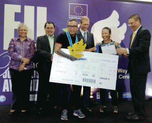 Davao-based journalist Jefry Tupas receives the top prize of the European Union Peace Journalism Awards from Presidential Adviser on the Peace Process Secretary Teresita Quintos Deles, Bangsamoro Transition Commission Chairman Mohagher Iqbal, European Union Ambassador Guy Ledoux, National Union of Journalists of the Philippines Chairperson Rowena Paraan and Mindanao State University Chancellor Sukarno Tanggo PHOTO FROM EU PHILIPPINES FACEBOOK PAGE