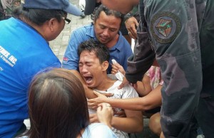 SHAKEN A survivor of a sinking of a  ferry cries after arriving at the pier in Ormoc City on Thursday.  AFP PHOTO 