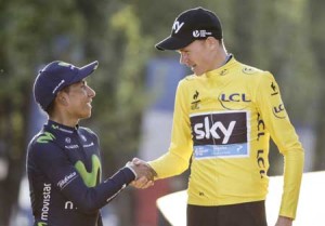 Tour de France 2015’s winner Great Britain’s Christopher Froome (right) shakes hand with second-placed Colombia’s Nairo Quintana. AFP PHOTO