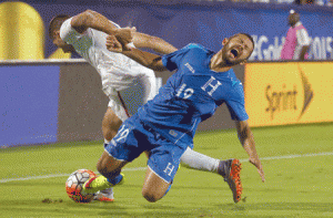 Clint Dempsey No. 8 of the US battles for control of the ball against Alfredo Mejia No.19 of Honduras during the 2015 CONCACAF Gold Cup Group A match between the US and Honduras at Toyota Stadium on Wednesday in Frisco, Texas. AFP PHOTO