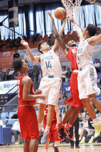 CSB’s Jonathan Grey battles EAC’s Laminou Hamadou for the rebound in the basketball tournament of the National Collegiate Athletic Association at the San Juan Arena on Tuesday. PHOTO BY OSWALD LAVINA