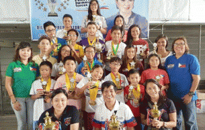 MOST OUTSTANDING SWIMMERS  Philippine Swimming League (PSL) President Susan Papa and Secretary General Maria Susan Benasa pose with coaches Ava Dimalanta of Diliman Preparatory School, Joey Andaya of JA Swim Team, and Shirley Tom of Marikina Aquabears, and Most Outstanding Swimmer awardees of the 79th PSL National Series dubbed at the Sen. Nikki Coseteng Swim Championship. CONTRIBUTED PHOTO