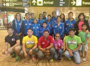 Philippine Swimming League President Susan Papa and Secretary General Maria Susan Benasa with the coaches and swimmers seeing action in the 2015 Singapore Invitational Swimming Championship beginning on Saturday. CONTRIBUTED PHOTO