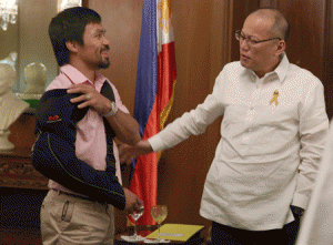 Manny Pacquiao in an arm sling exchanges pleasantries with President Benigno S. Aquino 3rd during a courtesy call at the Music Room of the Malacañang Palace on May 13, 2015. MALACAÑANG PHOTO