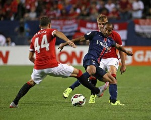 DOUBLE TROUBLE  Lucas Moura No.7 of Paris Saint-Germain controls the ball between Andreas Pereira No.44 and Luke Shaw No.3 of Manchester United during a match in the 2015 International Champions Cup at Soldier Field on Thursday in Chicago, Illinois. AFP PHOTO
