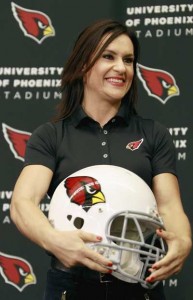 Jen Welter holds an Arizona Cardinals helmet after being named an intern coach to the team during a press conference on Wednesday in Tempe, Arizona. AFP PHOTO