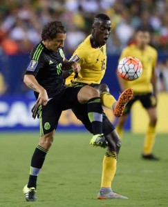 Mexico’s Andres Guardado (right) fights for the ball against Jamaica’s Je-Vaughn Watson during the 2015 CONCACAF Gold Cup final between Jamaica and Mexico in Philadelphia on Monday. AFP PHOTO