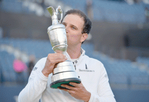 US golfer Zach Johnson kisses the Claret Jug, the trophy for the Champion golfer of the year as he poses for a photograph after winning the three-way playoff on day five of the 2015 British Open Golf Championship on The Old Course at St Andrews in Scotland, on Tuesday. AFP PHOTO