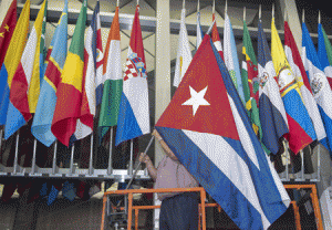 WELCOMING HAVANA  Workers at the US Department of State add the Cuban flag at to the display of flags inside the main entrance on July 20. The United States and Cuba formally resumed diplomatic relations on July 20, as the Cuban flag was raised at the US State Department in a historic gesture toward ending decades of hostility between the Cold War foes. AFP PHOTO