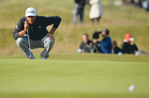 THE LEADER US golfer Dustin Johnson lines up his putt on the 17th green during the completion of his second round 69, on Day 3 of the 2015 British Open Golf Championship on The Old Course at Saint Andrews in Scotland on Sunday. AFP