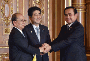 COOPERATION  Japan’s Prime Minister Shinzo Abe (C) shakes hands with Myanmar’s President Thein Sein (L) and Thailand’s Prime Minister Prayut Chan-O-Cha (R) after the signing ceremony on Dawei port project at the Akasaka State Guest House in Tokyo on Saturday. Leaders of five Mekong delta nations are in Tokyo to attend the Japan-Mekong Summit this weekend. AFP PHOTO