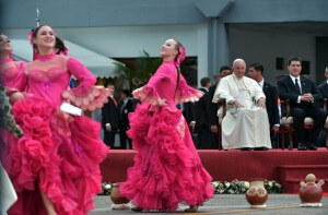 Pope Francis and  and Paraguayan President Horacio Cartes (right) watches performers during the welcoming ceremony in Asuncion, Paraguay. AFP PhoTo 