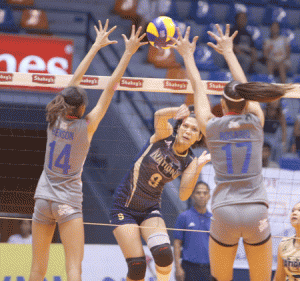 Danna Henson (14) and Joy Rosario (17) anchor Arellano U’s solid net defense as they thwart National U’s Aiko Urdas’ attack during their Shakey’s V-League Season 12-Collegiate Conference clash at The Arena. CONTRIBUTED PHOTO