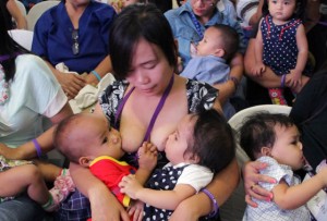 SEEING DOUBLE  A mother breastfeeds her child in a mall in Mandaluyong City, to celebrate National Breastfeeding Awareness Month. The Philippines observes breastfeeding awareness month in August every year to boost awareness of the health and economic benefits and a goal to create a breastfeeding nation.  PHOTO BY MIKE DE JUAN 