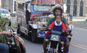 JOYRIDE’S OVER  A new law signed by President Benigno Aquino 3rd prohibits children from riding motorcycles like this one spotted by The Manila Times photographer Abby Palmones along A. Soriano Street in Intramuros, Manila. 
