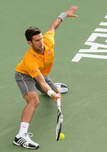 Novak Djokovic of Serbia returns the ball during day two of the Rogers Cup against Thomaz Bellucci of Brazil at Uniprix Stadium on Wednesday in Montreal, Quebec, Canada. AFP PHOTO