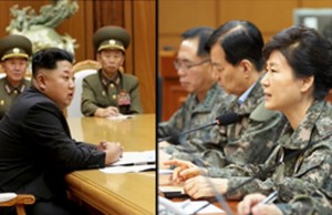 RATTLING SABERS South Korea’s President Park Geun-Hye (2nd from right), wearing a camouflage military uniform,  speaks to army officials in Yongin, south of Seoul, as North Korean leader Kim Jong-Un presides over an emergency meeting of the Workers’ Party of Korea Central Military Commission. AFP PHOTOS