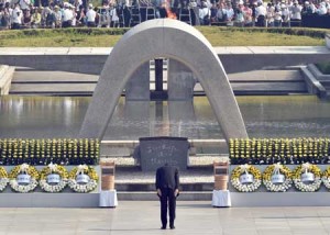 SOMBER MEMORIAL  Japanese Prime Minister Shinzo Abe bows in front of the memorial cenotaph for victims of a 1945 atomic bombing during a memorial ceremony to mark the 70th anniversary at the Hiroshima Peace Memorial Park in western Japan on August 6. Tens of thousands gathered for peace ceremonies in Hiroshima on the 70th anniversary of the atomic bombing that helped end World War II, but still divides opinion today over whether the total destruction it caused was justified. AFP PHOTO