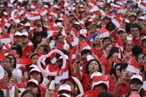 LKY’S LEGACY  People wave national flags during Singapore’s 50th National day anniversary celebration at the Padang in Singapore on August 9. Singapore celebrated 50 years of independence on August 9 with a grand parade, hailing a remarkable transformation from colonial backwater to regional powerhouse, for the first time without its revered founding leader Lee Kuan Yew. AFP PHOTO