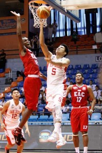 San Beda’s Jeramer Cabanag drives through the defense of EAC’s Hamadou Laminous to in the second round elimination of the 91st National Collegiate Athletic Association basketball tournament at The Arena in San Juan City on Tuesday. PHOTO BY OSWALD LAVINA