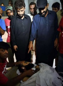 NO MERCY Pakistani relatives look at the body of convicted murderer Shafqat Hussain at a mortuary after his execution in Karachi on August 4. Pakistan executed Hussain, whose supporters say was a juvenile at the time of his crime, despite strenuous objections from rights groups and the United Nations. AFP PHOTO