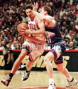 Toni Kukoc (left) of the Chicago Bulls tries to get past Adam Keefe (R) of the Utah Jazz during the 1998 NBA Finals at the United Center in Chicago, Illinois. AFP FILE PHOTO
