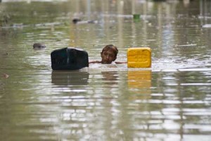 AN UNPLEASANT COMMUTE  A flood-affected resident swims through floodwaters in Kalay, upper Myanmar’s Sagaing region on August 3. Relentless monsoon rains have triggered flash floods and landslides, destroying thousands of houses, farmland, bridges and roads—with fast-flowing waters hampering relief efforts. AFP PHOTO