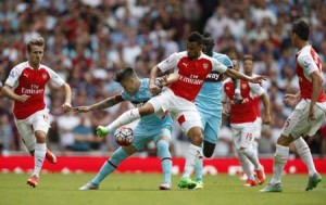 West Ham United’s Argentinian striker Mauro Zarate (second left) vies with Arsenal’s French midfielder Francis Coquelin during the English Premier League football match between Arsenal and West Ham United at the Emirates Stadium in London on Sunday. AFP PHOTO