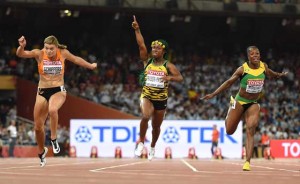 Jamaica’s Shelly-Ann Fraser-Pryce celebrates in front of Netherlands’ Dafne Schippers and Jamaica’s Veronica Campbell-Brown after winning the finals of the women’s 100 meters athletics event at the 2015 IAAF World Championships at the “Bird’s Nest” National Stadium in Beijing on Monday. AFP PHOTO