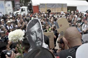 MEDIAMAN KILLED  Mexican photojournalists hold pictures of their murdered colleague Ruben Espinosa during a demostration held at the Angel of Independence Square in Mexico City, on August 2. Espinosa was found shot dead on August 1 in Mexico City, where he had moved two months ago from Veracruz, after reporting strong threats from the government of the state. Since 2010, 11 journalists have been killed and four others have gone missing in Veracruz. AFP PHOTO