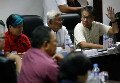 Defense Secretary Voltaire Gazmin (second from right) on Sunday presides during an assessment of damage done by Typhoon Ineng to the northern provinces at the offices of the National Disaster Risk Reduction and Management Council inside Camp Aguinaldo in Quezon City. Gazmin was joined by Interior Secretary Manuel Roxas 2nd (right), Social Welfare Secretary Corazon Soliman (to Gazmin’s right), Transportation Secretary Joseph Abaya (not shown) and representatives of concerned government agencies. PHOTO BY MIGUEL DE GUZMAN