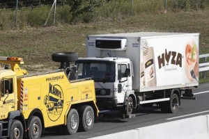 HORRIFYING CARGO  A refrigerated truck is towed along a highway near Neusiedl am See, Austria, on August 27. The bodies of at least 70 migrants have been found in the truck on the A 4 highway in Austria, police said Thursday, the latest tragedy involving people desperately trying to reach Europe. AFP PHOTO