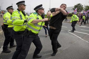 NO TO MIGRANTS   Police clash with nationalist counter demonstrators as people rally to support migrants trying to cross into England through the channel tunnel from France, near an entrance to the Eurotunnel terminal in Folkestone, south east England, on August 1. French police said Saturday some 300 migrants in Calais attempted to reach Britain via the cross-Channel tunnel overnight, a significant drop from previous nights as the security presence is beefed up. AFP PHOTO