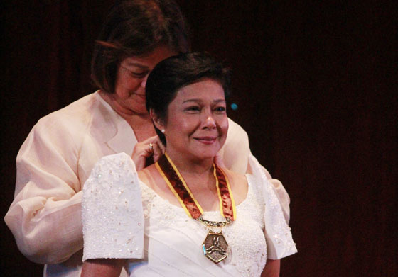 Cultural Center of the Philippines chairman Emily Abrera bestows the CCP Gawad para sa Sining medal to veteran actress Nora Aunor in a ceremony last Thursday. Aunor, known as the “Superstar” of Philippine show business, is one of the 11 individuals that were given the award which the CCP gives every three years. PHOTO BY ABBY PALMONES