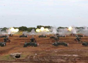 BIG GUNS  In this photo provided by the Military News Agency, ROC (Republic of China) army artillery batteries open fire in Hsinchu County on September 4 as part of preparations for Taiwan’s annual Han Kuang military exercises.