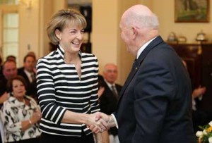 DOMESTIC VIOLENCE ON THE AGENDA New Minister for Women Michaelia Cash (L) is congratulated is congratulated by Governor-General Peter Cosgrove (R) during the new cabinet swearing-in ceremony at Government House in Canberra on September 21. Australia on Thursday announced a broad initiative to combat the spread of domestic violence, which new PM Malcolm Turnbull called a “national disgrace.” AFP PHOTO