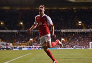 Arsenal’s French midfielder Mathieu Flamini celebrates after scoring their seond goal during the English League Cup third round football match between Tottenham Hotspur and Arsenal at White Hart Lane in north London on Thursday. AFP PHOTO