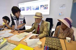 LOST LOVED ONES  South Korean officials help elderly people who left behind relatives in North Korea to fill out applications for an expected inter-Korean family reunion program at the Red Cross office in Seoul on September 7. North and South Korean Red Cross officials kicked off talks on September 7 on organizing a rare and emotional reunion for families separated by the Korean War. AFP PHOTO