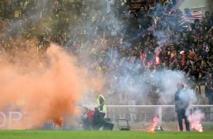 QUALIFIER CHAOS  Malaysian fans watch after throwing flares on the pitch during the 2018 FIFA World Cup qualifying football match between Malaysia and Saudi Arabia in Shah Alam. AFP PHOTO