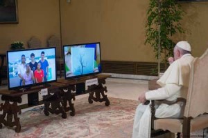 MESSAGE OF LOVE  This handout picture released by the Vatican press office on Saturday shows Pope Francis watching a video message from Cuba and USA’s faithfuls on Friday prior to his trip to their countries. AFP PHOTO