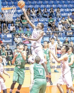 EAC’s Bigman Hamadou Laminou breaks through the defense of the Saint Benilde Blazers to score an easy basket in the National Collegiate Athletic Association Season 91st men’s basketball tournament at The Arena in San Juan City on Friday. PHOTO BY OSWALD LAVINA