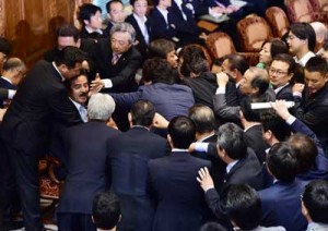 LEGISLATIVE THROWDOWN  Opposition lawmakers rush to acting chairman Masahisa Sato (2nd L-with moustache) during the Upper House’s ad hoc committee meeting on the controversial security bills, at the National Diet in Tokyo on September 17. Japan’s ruling and opposition parties remained deadlocked in parliament over the proposed bills as thousands took to the streets in protests against legislation that could see troops fight overseas for the first time in 70 years. AFP PHOTO