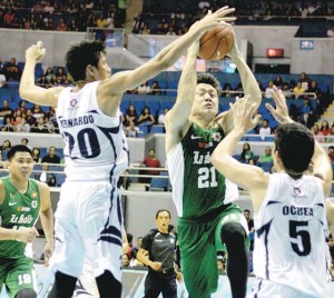 De La Salle University Green Archers' Jeron Teng tries to get past the defense of the Adamson University Soaring Falcons during their game in the University Athletic Association of the Philippines Season 78 at the Araneta Coliseum in Quezon City on Sunday.  PHOTO BY MIGUEL DE GUZMAN