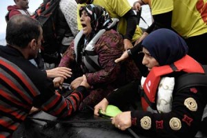 TEARS OF RELIEF  Women react as they arrive on a dinghy with other refugees and migrants to the Greek island of Lesbos after crossing the Aegean Sea from Turkey on September 29. More than half a million migrants and refugees have crossed the Mediterranean to Europe so far this year — 383,000 of them arriving in Greece, the United Nations said. AFP PHOTO