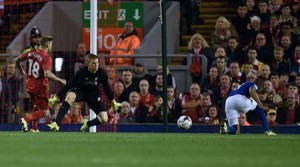 Carlisle United’s Ghanaian striker Derek Asamoah (right) scores their first goal past Liverpool’s Hungarian goalkeeper Adam Bogdan (second left) during the English League Cup third round football match between Liverpool and Carlisle United at Anfield in Liverpool, north west England on Thursday. AFP PHOTO